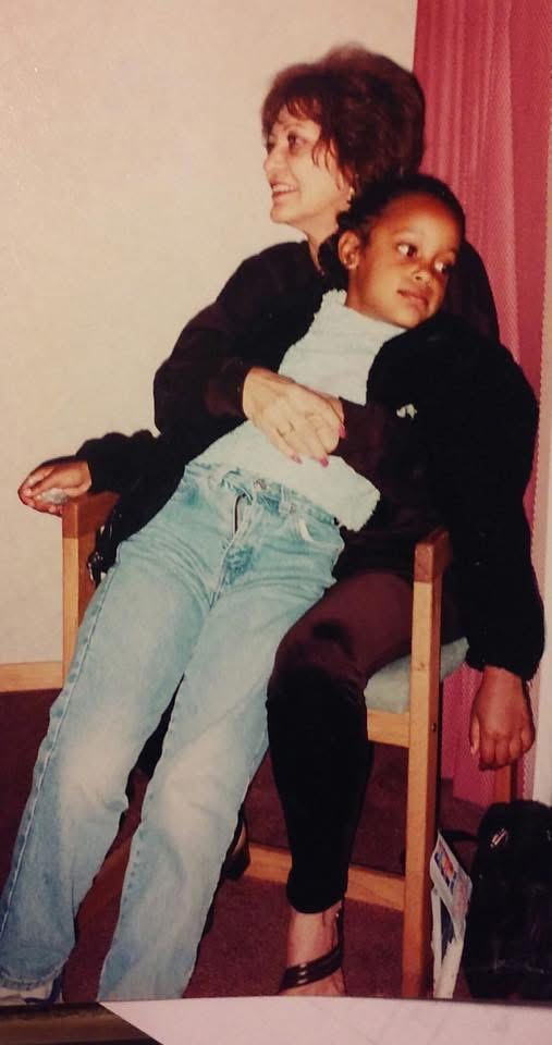 Brittney as a child on her grandmother's lap
